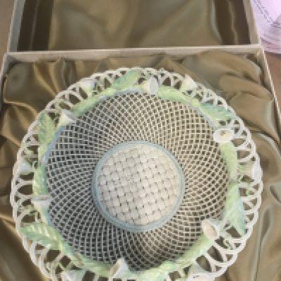 A Belleek basket with raised flower heads in original box .
