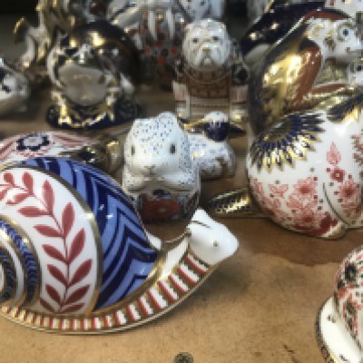 A Collection of 21 Royal crown derby animals weights with gold stoppers.