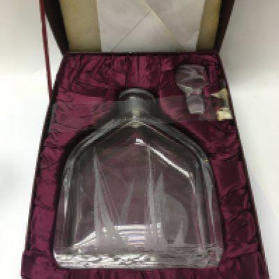 A mixed lot of ceramics including a decanter, some Swarovski, two pieces of Royal Worcester and a collection of wade hat box figures.