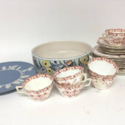 A Poole pottery bowl a Wedgwood Jasperware plate and a late Victorian tea set with a red floral pattern on a white ground.