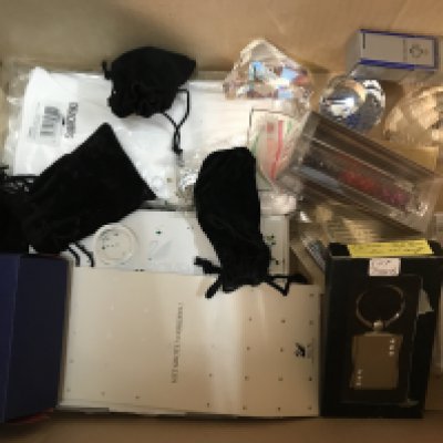 A mixed collection of Swarovski items including SCS commemorative paperweights, birthday cake, gloves etc