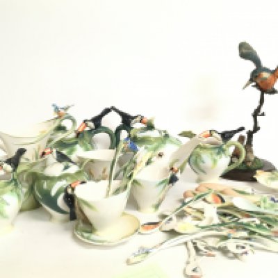 A collection of Franz toucan and kingfisher porcelain cups, saucers, cutlery and a Country Artists Kingfisher figure. This lot cannot be posted