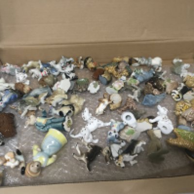 A collection of Wade Whimsies including some Disney figures.
