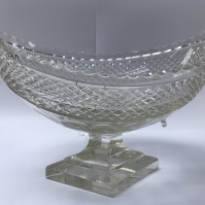 An oval cut glass bowl on a lozenge base