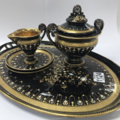 A Swedish earthenware black glazed tea set with jewelled decoration (no cups)