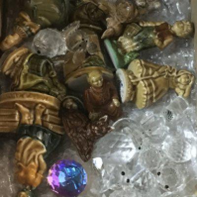 A small box containing Wade whimsies and Swarovski animals