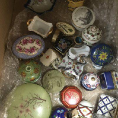 A box containing Del Prado trinket boxes and others various