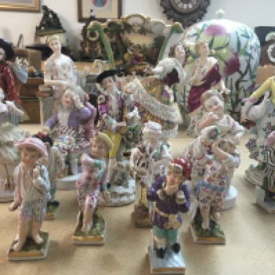 A collection of 19th century classical style figures including sitzendorf and Dresden