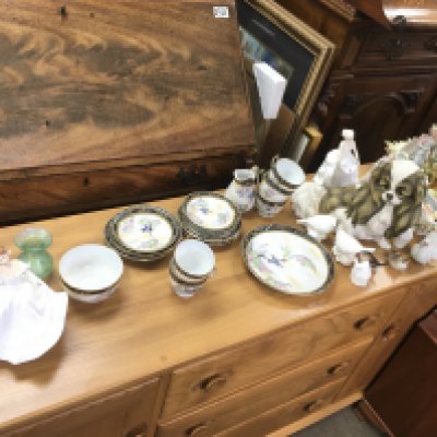 A large collection of mixed ceramics items including part tea set royal Doulton figurines a resin dog etc.