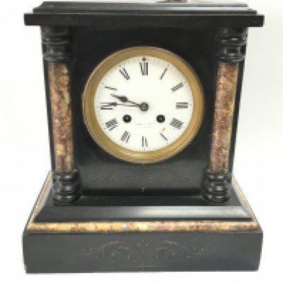 A black slate Bennett Bros Liverpool mantel clock. Dimensions approximately 17x27x29.5cm. This lot cannot be posted