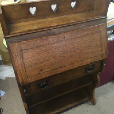 A mahogany Bureau with carved heart design. dimensions 30x73x112cm
