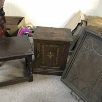 A small oak side table, small walnut cabinet and a carved design tray