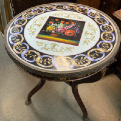 A Modern porcelain topped occasional table with painted and floral decoration. 61cm diameter x 77cm Height. (D)