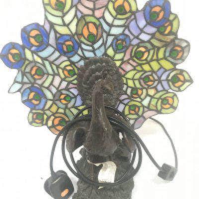 A lead light and simulated bronze table lamp in the form of a Peacock. Height 36cm