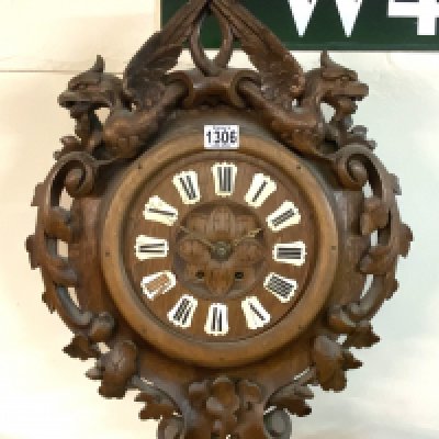 A 19thC Black Forest oak carved oak wall clock. (D)