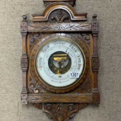 A Victorian carved oak Aneroid barometer. 65cm x 34cm. (D)