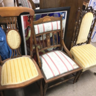 A Victorian oak chair and two Edwardian chairs.
