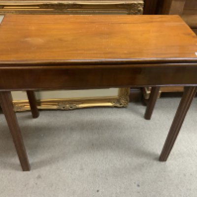 A Georgian Mahogany folding card table with square receded legs. 88.5cm x 42cm x 75cm.