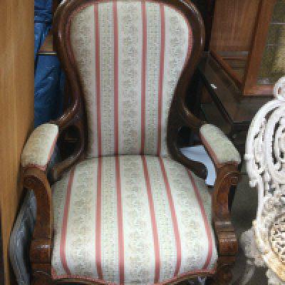 A Victorian open armchair. Shipping category D.