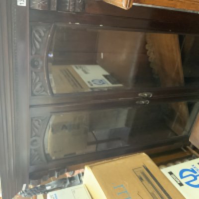 A carved and glazed bookcase. (D)