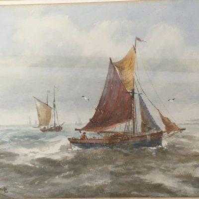 A framed watercolour Marine view with sailing fishing boats signed by RT Wilding.