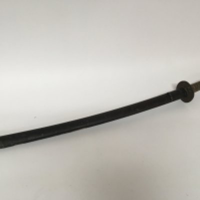 An Antique Japanese Samurai sword with a bound shagreen grip cast metal tusuba steel folded blade. Lacquered sheath. the blade rust particularly towards the point lenght total length 103cm