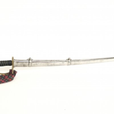 A French cavalry sword with a 58cm long blade, leather handle and a leather scabbard. This lot cannot be posted