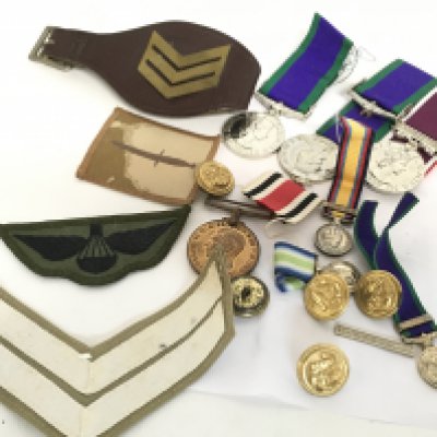 A collection of medals, miniatures, buttons, badges etc