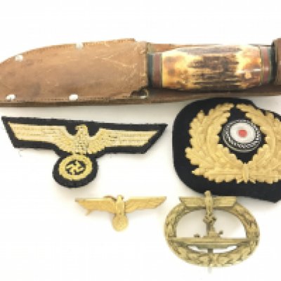WW2 Nazi Germany badges including a Kriegsmarine cap badge, U boat badge and a Taylors Eye Witness Scout knife. This lot cannot be posted
