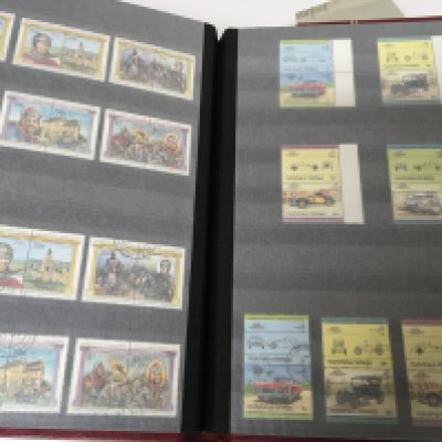 Six red albums Davo containing World stamps mainly British commonwealth.lots of unused and unused Tuvalu Singapore South West Africa and many others these albums are approximately half full. (6)