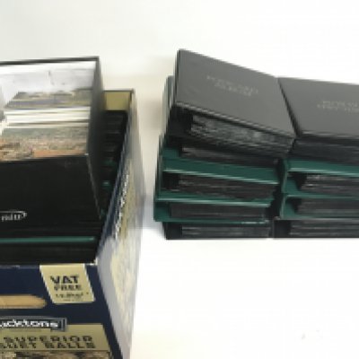 A collection of post card albums containing various vintage cards including topographical, trains