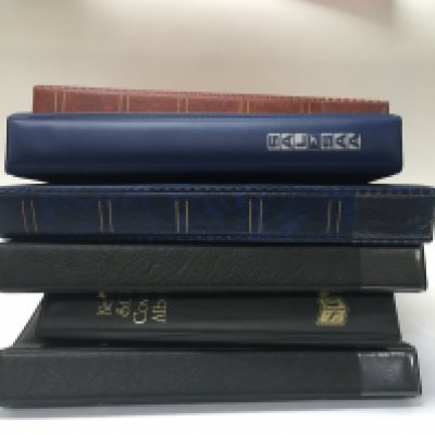 A collection of south African stamp albums and with a collection of loose stamps and and packs.