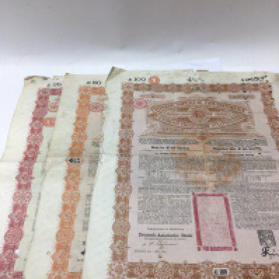 Three chinese bonds including bonds with the amounts of &pound;100,&pound;50 and &pound;25.