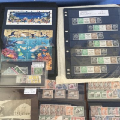 A collection of well presented British Empire George VI stamps Kenya Uganda an interesting train crash picture postcard and other stamps.