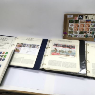 A large collection of first day covers and world stamps.