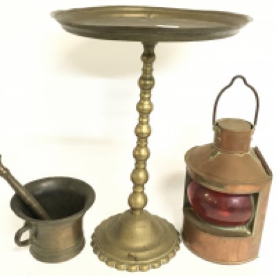 A brass pestle and mortar, copper port bow light, brass pedestal (44cm tall)