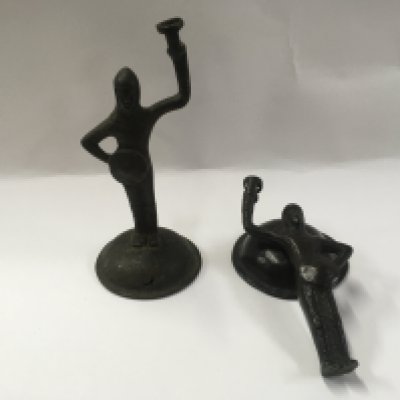 A pair of unusual bronze antique knight wick holders.
