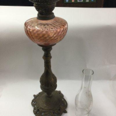 A tall Victorian oil lamp.