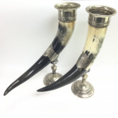 A pair of silver plated cow horn drinking vessels, 38.5cm tall. Postage category C