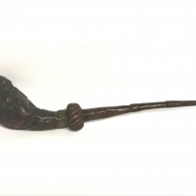 A 19th century copper opium pipe, 42cm long. Postage category C
