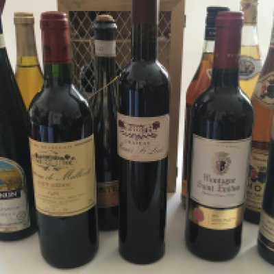 A collection of wines including Vintage 1995 Chateau de Malleiet Montaigne Saint Emillion 2016 other wines and spirits.