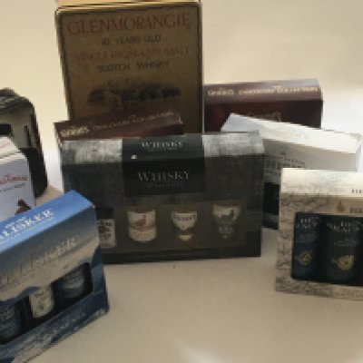 A collection of small bottles of Presentation Whisky Ben Bracken Glenmorangie Grants Talisker and Bowmore (9)