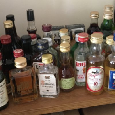 A collection of miniatures including whisky and many other spirits.