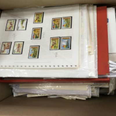 A box containing a large quantity of stamps presented on sheets and other associated philatelic covers etc