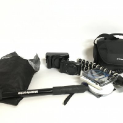 A Sony Cyber Shot DSC-HX50v camera with various camera accessories including a tripod, cables etc. Postage category C