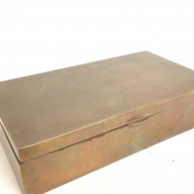 A Cartier copper Enigma wedding invitation box, 4x9.5x17cm. Postage category B