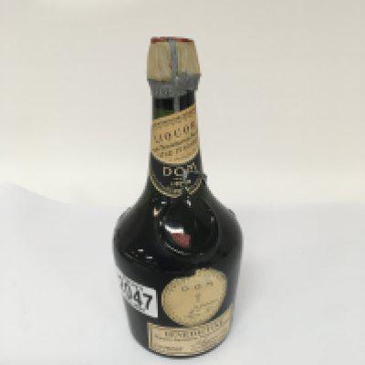 A 1950s bottle of DOM Benedictine 73% Proof Liquor. Capacity not stated on bottle possible 500ml.