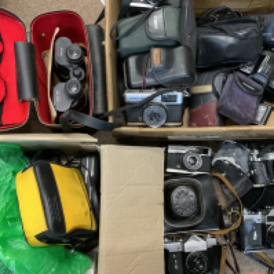 A large collection of cameras and camera equipment including a Zenit B model, Canondate E cazmera, (D)