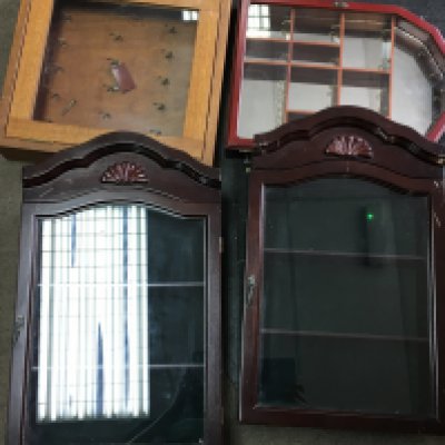 A collection of wooden and glass display cases