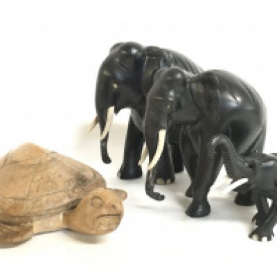 A collection of ebony elephants and a wooden tortoise figure. Tallest figure 18cm tall. Postage category C